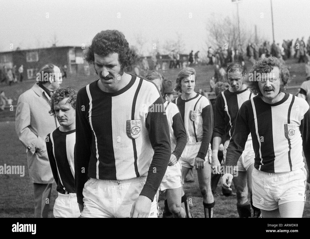 football, Regionalliga West, 1973/1974, Eintracht Gelsenkirchen versus 1. FC Muelheim 4:2, Sued Stadium Gelsenkirchen, football players leave the pitch, f.l.t.r. Reiner Greiffendorf (Muelheim), Peter Nover (Muelheim), Hartmut Limpert (Muelheim), Heiko Mer Stock Photo