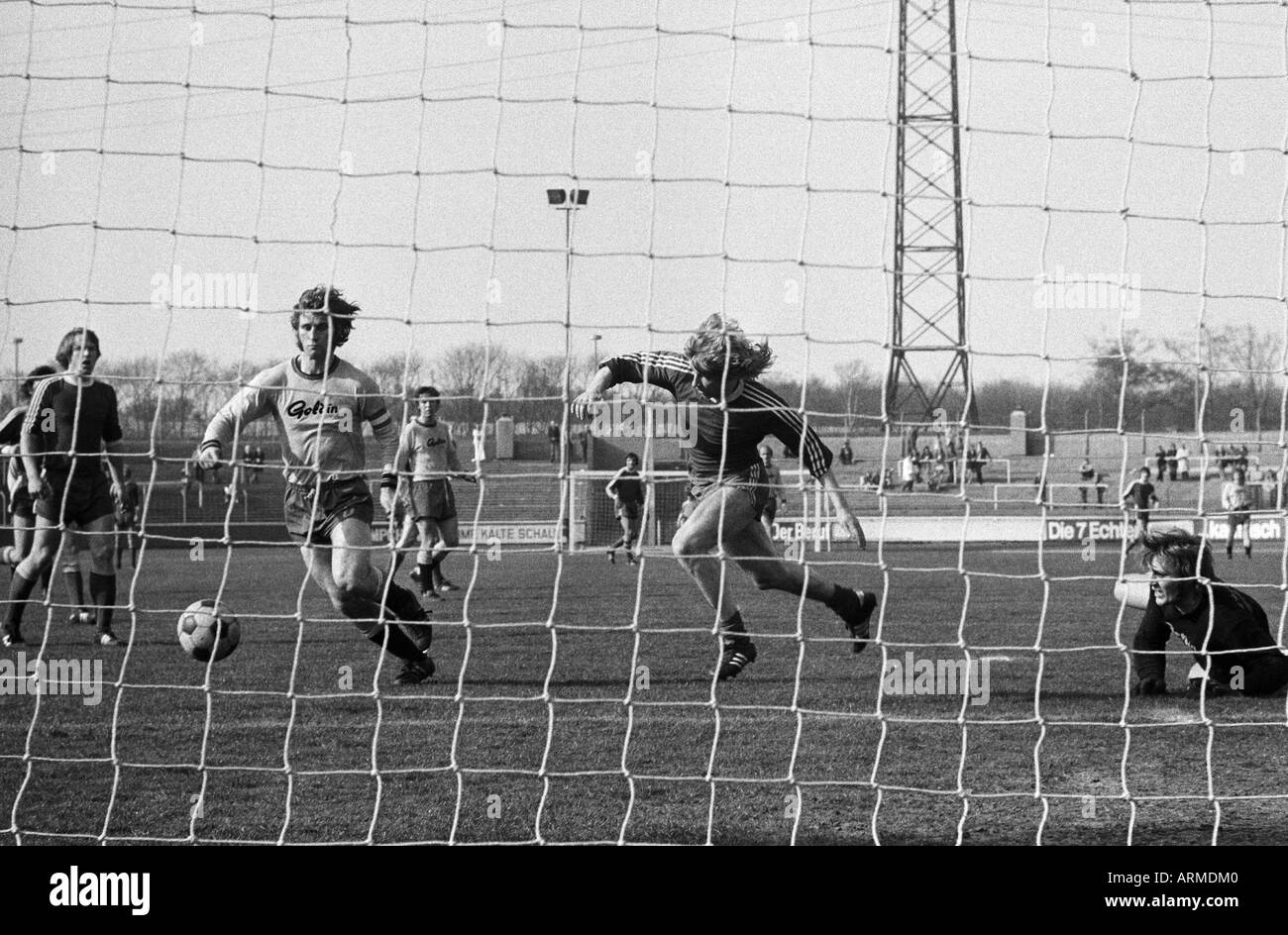 football, Regionalliga West, 1973/1974, Niederrhein Stadium in Oberhausen, Rot-Weiss Oberhausen versus Westfalia Herne 5:0, scene of the match, f.l.t.r. Lothar Kobluhn (RWO), Gerd Wiesemes (Herne), a Herne player, Werner Greth (RWO), keeper Bernhard Hartm Stock Photo