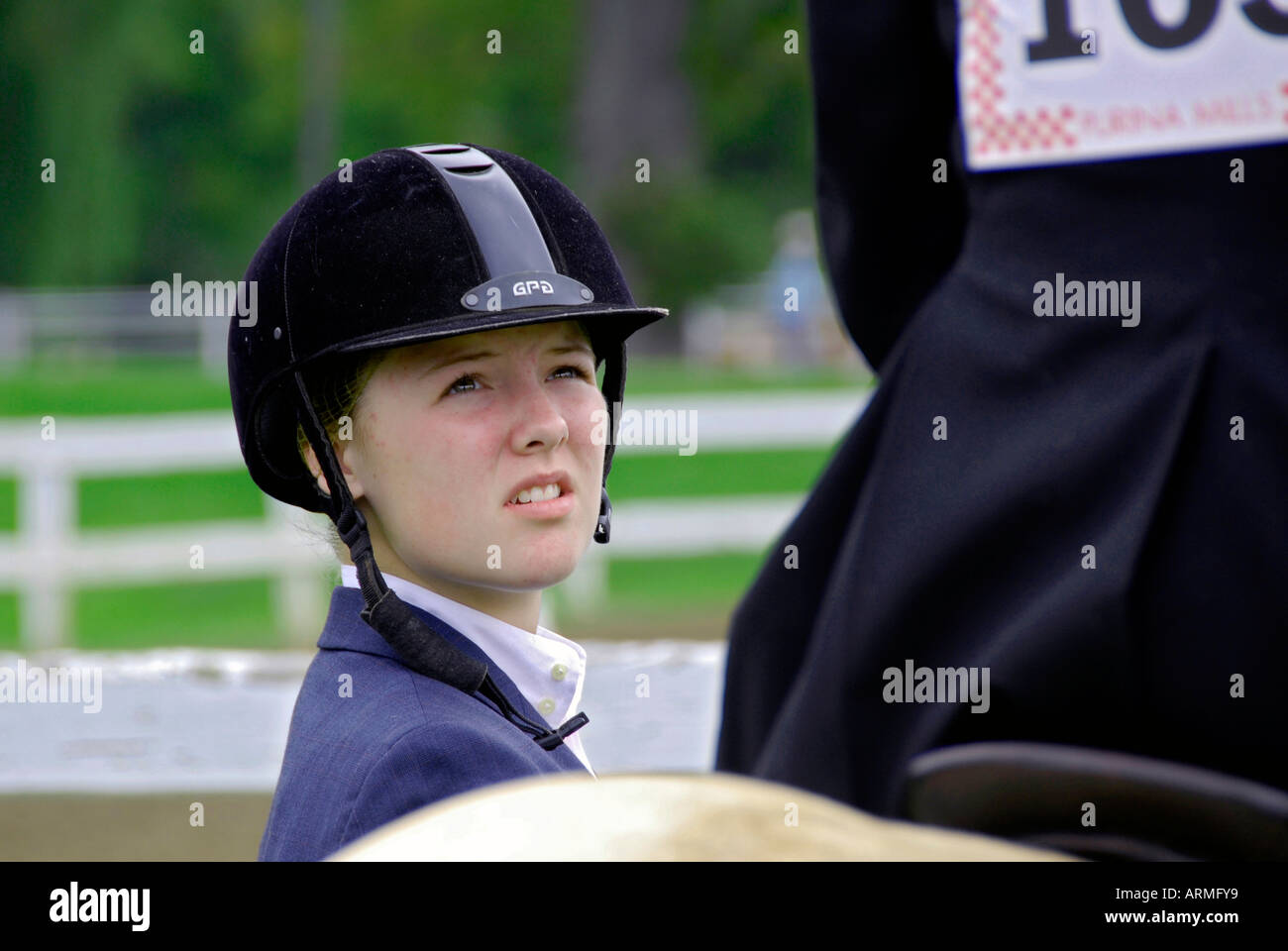 High school female student competes in equestrian event Stock Photo