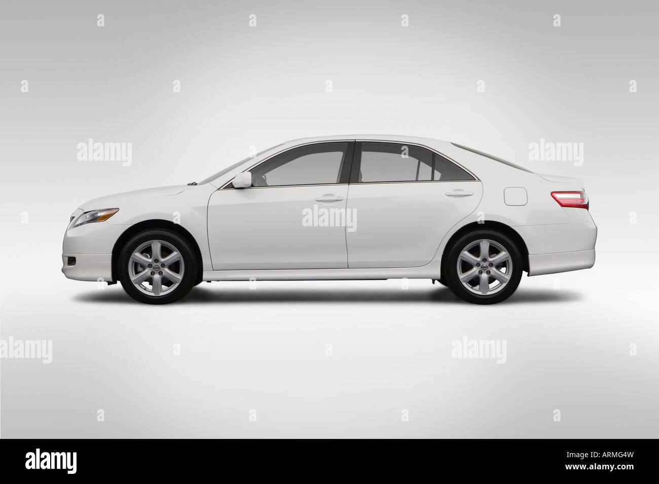 2008 Toyota Camry SE in White - Drivers Side Profile Stock Photo