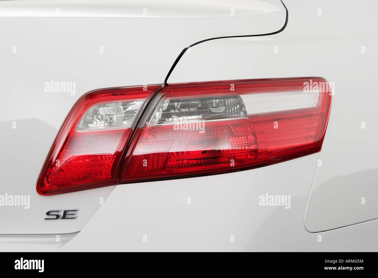 2008 Toyota Camry SE in White - Tail light Stock Photo