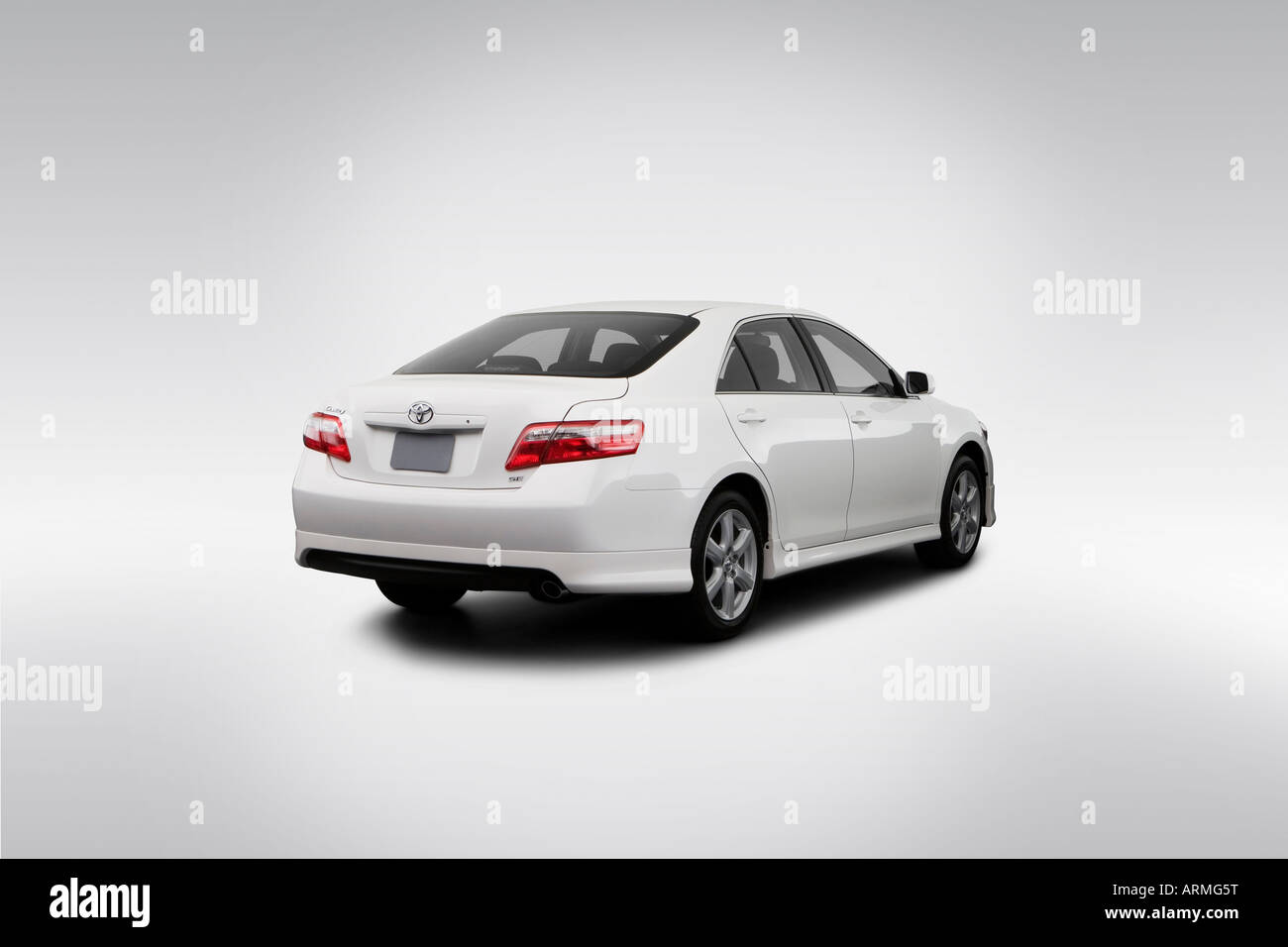 2008 Toyota Camry SE in White - Rear angle view Stock Photo
