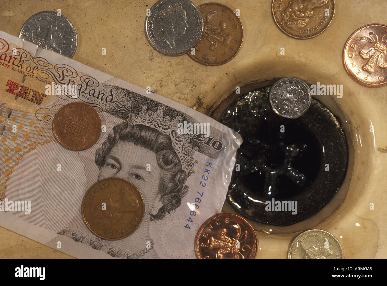 Money down drain hires stock photography and images Alamy