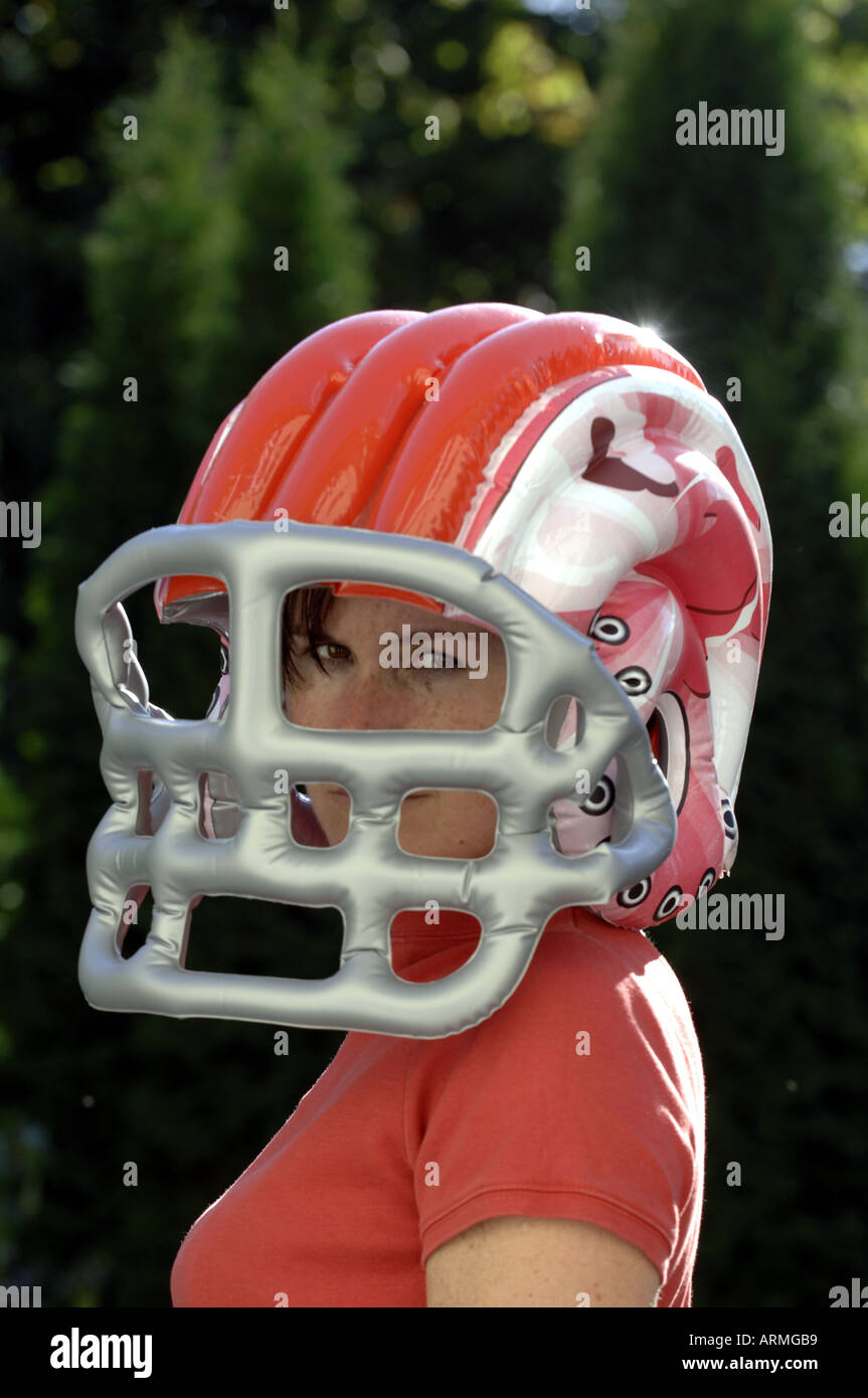 young, woman, wearing, inflatable, joke, American, football, helmet,  female, Caucasian, girl, twenties, thirties, play, game, fu Stock Photo -  Alamy