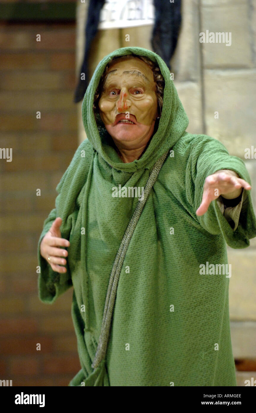 actor in mask and green cloak Stock Photo - Alamy