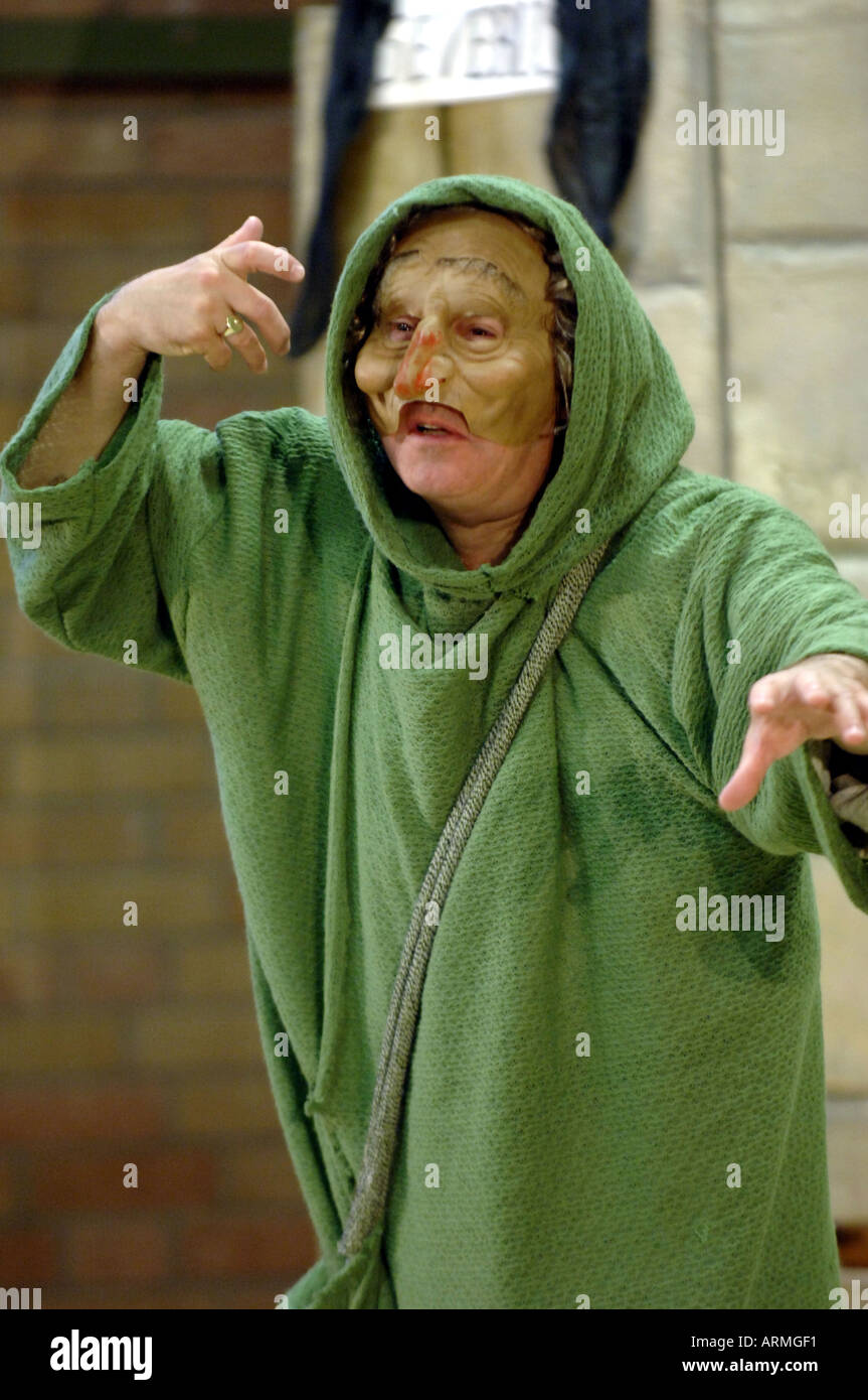 actor in mask and green cloak Stock Photo - Alamy