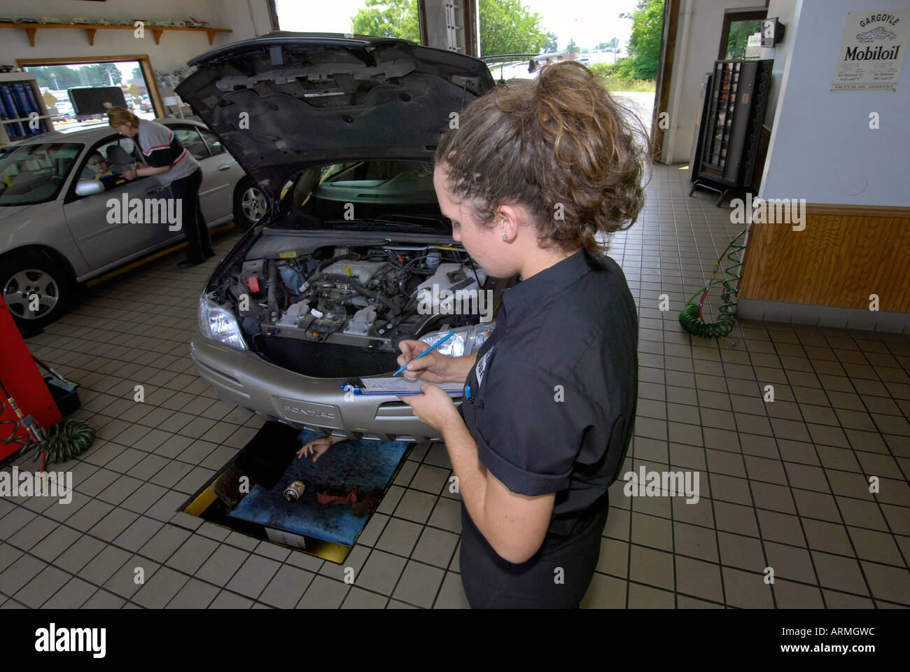 Quick oil change garage where drive in customers have oil changed in