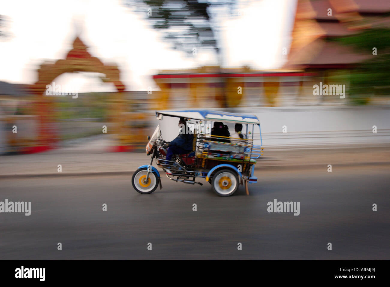 Tuk Tuk racing through Vientiane, Laos, Indochina, Southeast Asia, Asia Stock Photo
