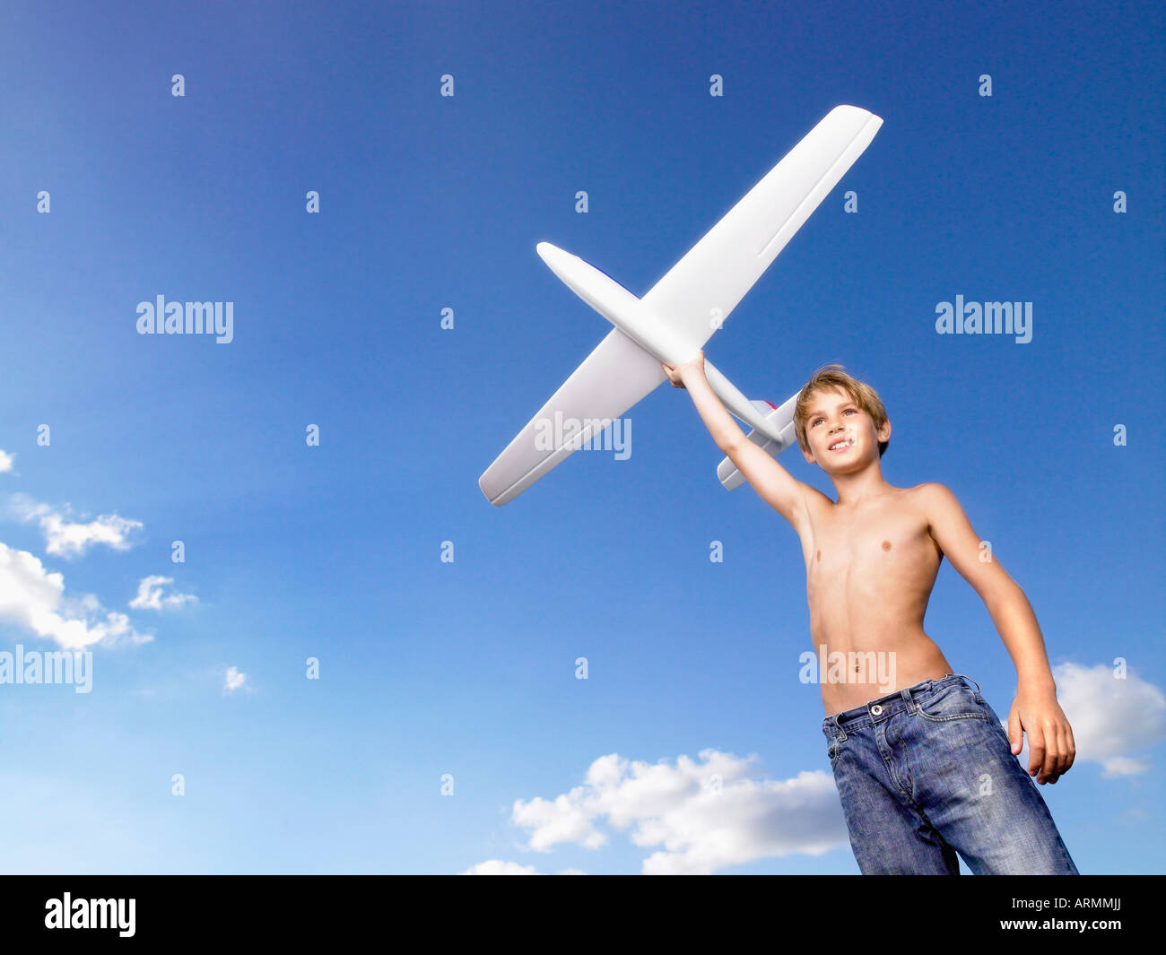 Young boy ready to send off an airplane Stock Photo