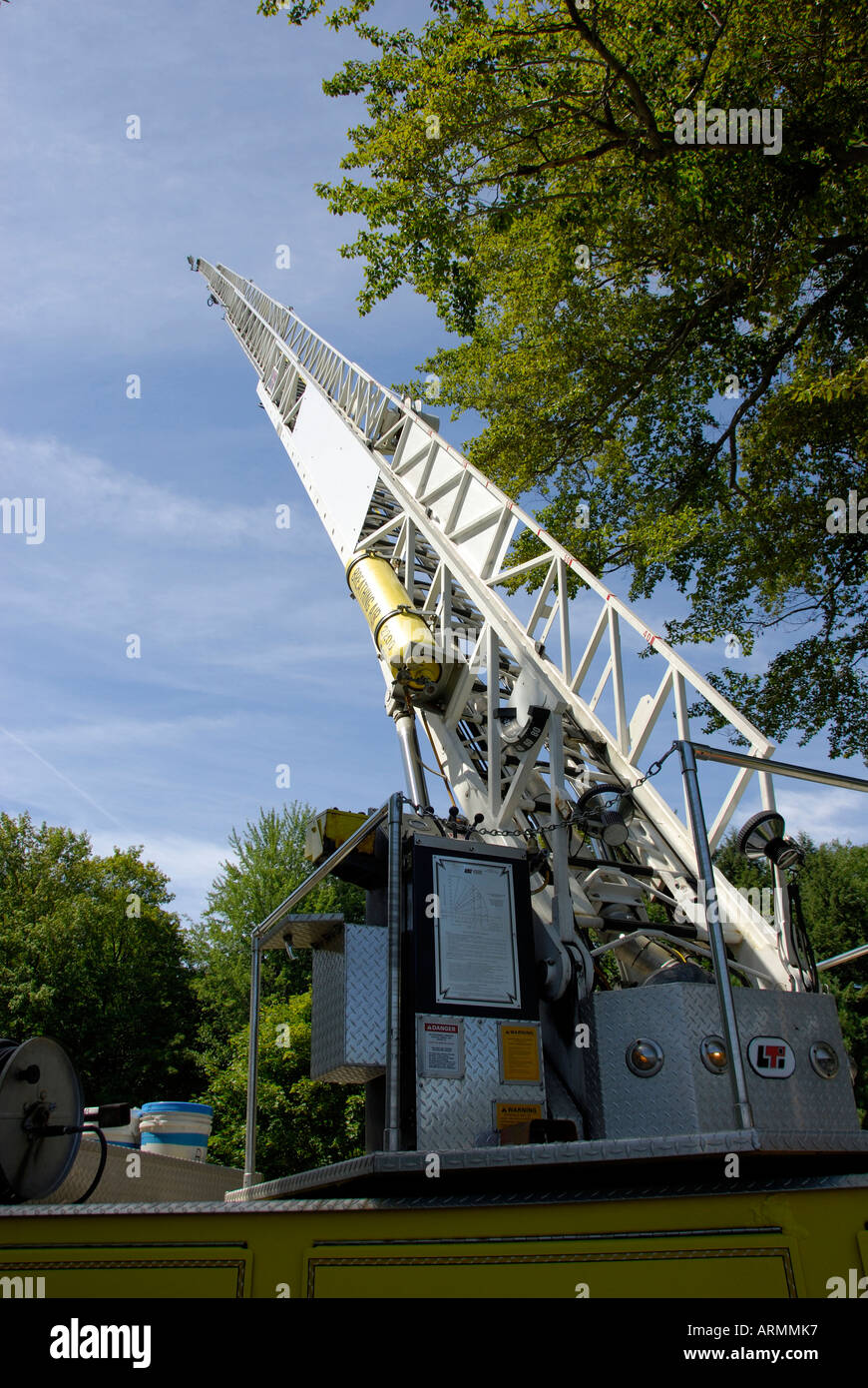 long and tall ladder on a fire truck shows various degrees of level and