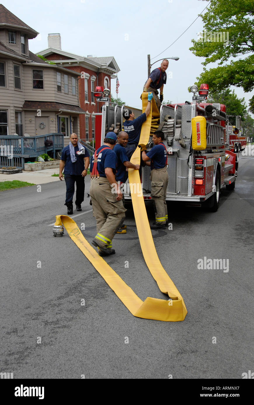 Fireman with fire fighting equipment respond to emergency fire situations Stock Photo