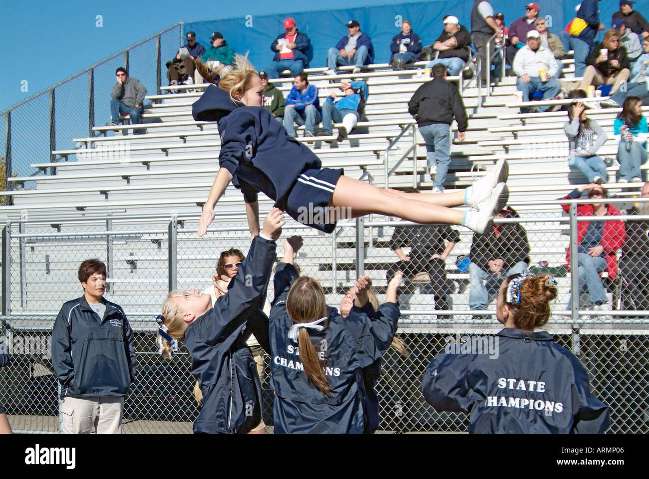 High School cheerleaders perform complicated and sometimes dangerous
