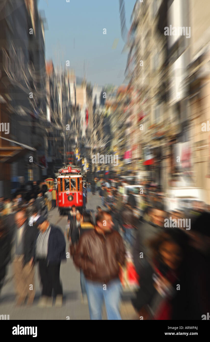 ISTANBUL, TURKEY. Shopping thoroughfare of Istiklal Caddesi in Beyoglu district, with Tunel-Taksim tram approaching. 2007. Stock Photo