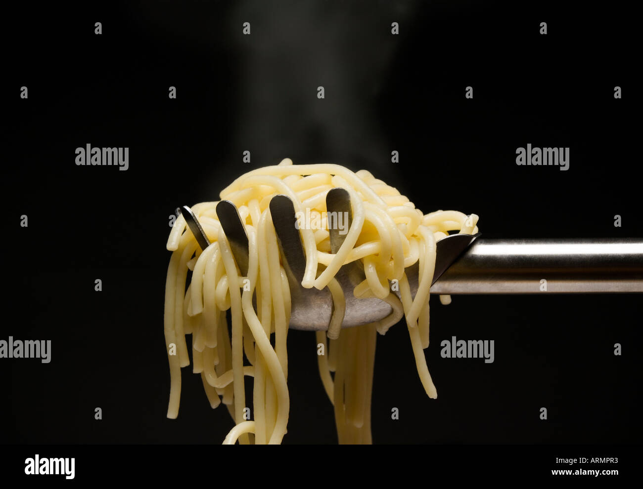 Spaghetti in ladle Stock Photo Alamy