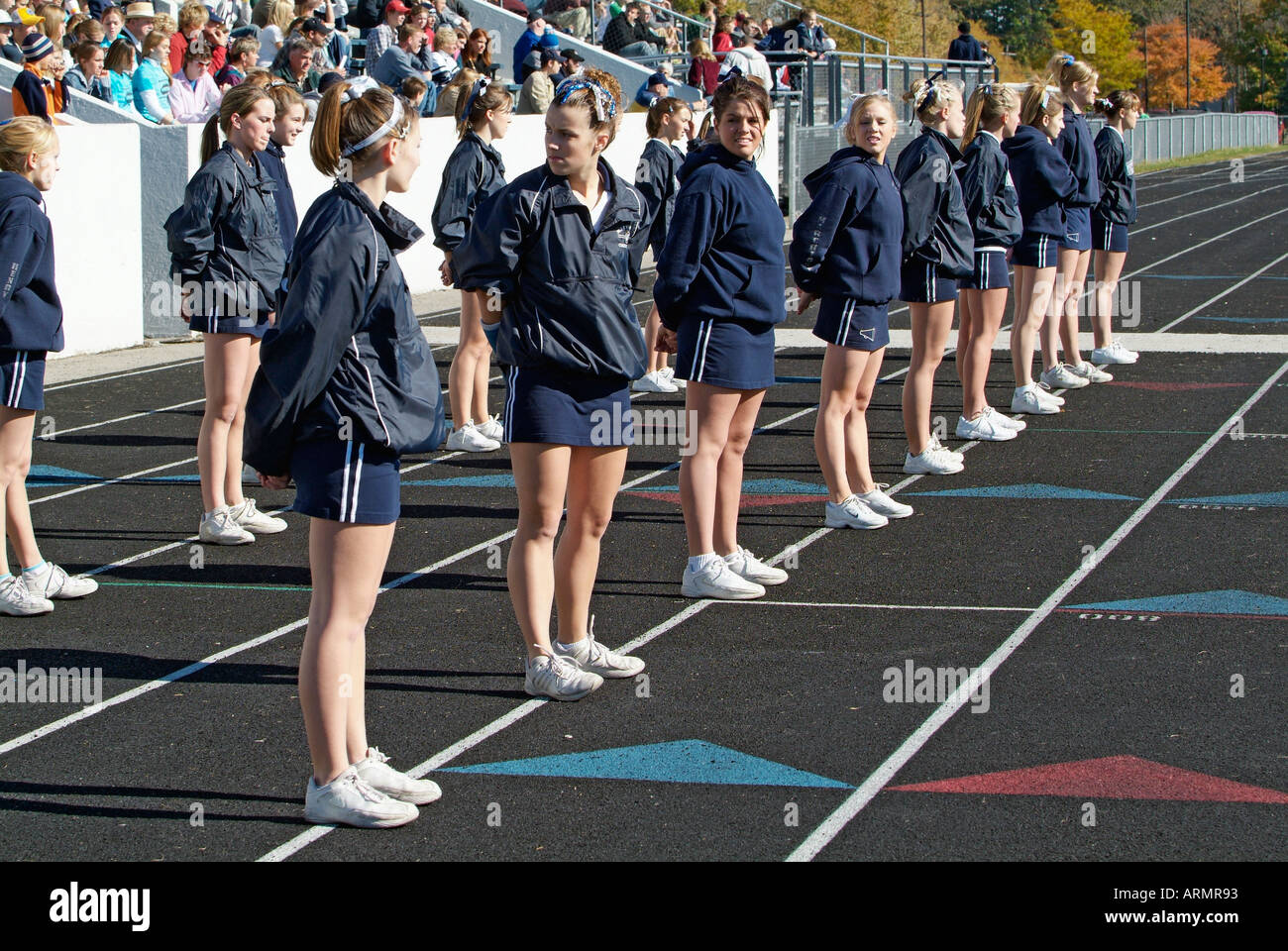 High School cheerleaders perform complicated and sometimes dangerous maneuvers during