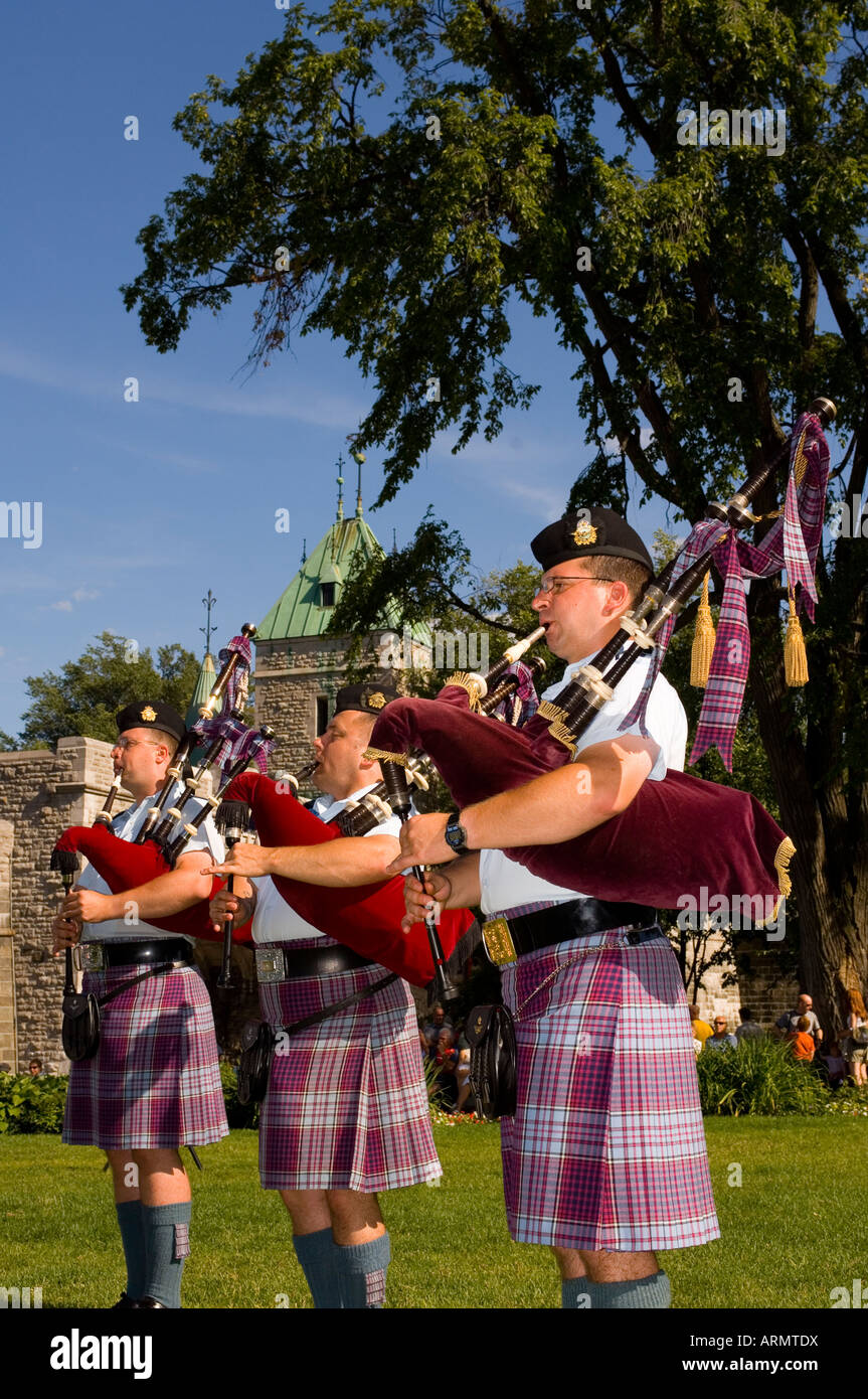 Military pipe and drum band at tatoo, Porte St. Louis, one of the entrances of the walled city of old Quebec, Quebec, Canada. Stock Photo