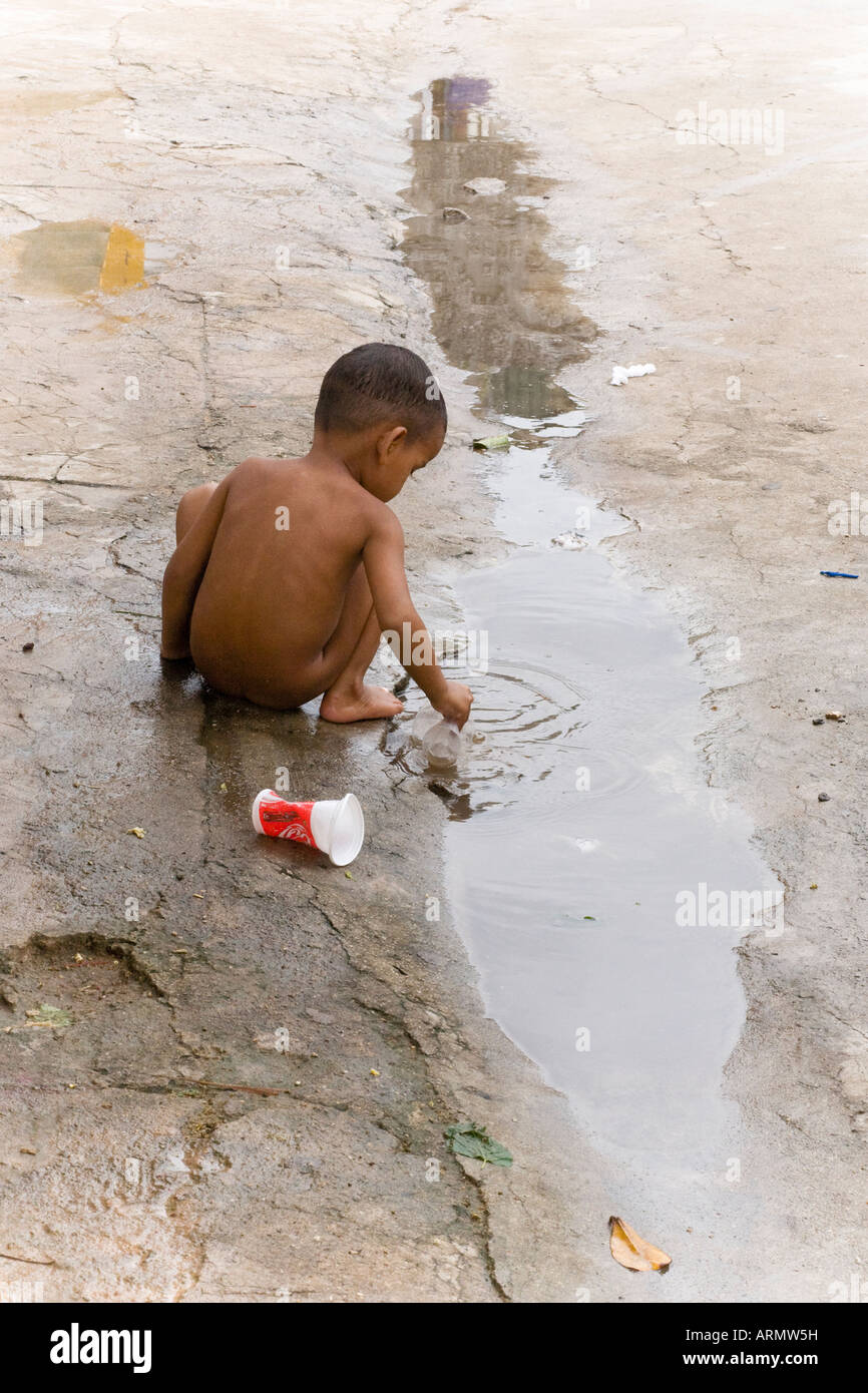 83net kids young asia naked'" young naked cambodian asian boy playing in a dirty puddle Stock Photo -  Alamy
