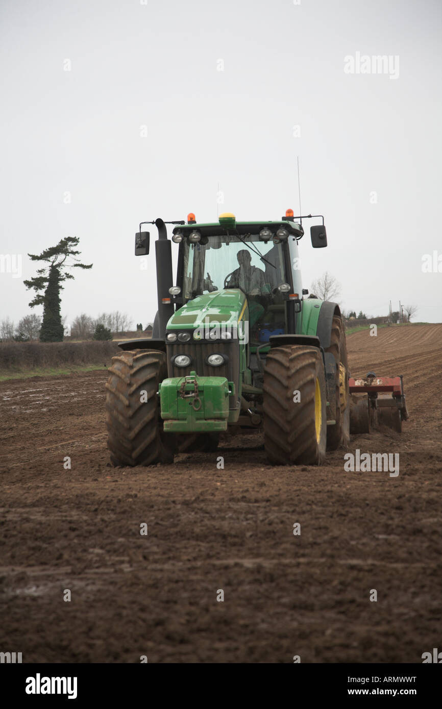 John Deere Tractor harrowing field Butley Suffolk England Stock Photo ...