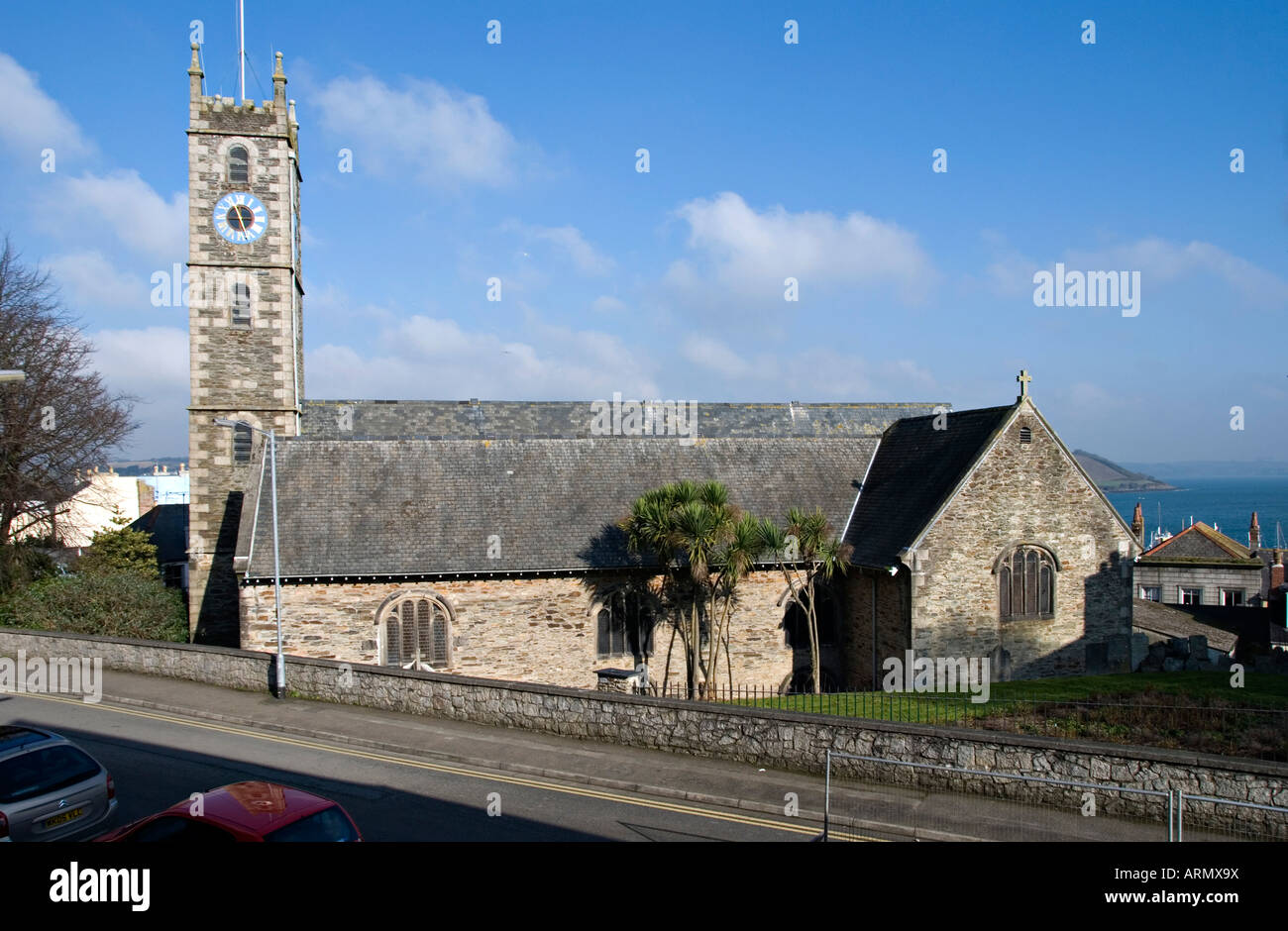Falmouth, Cornwall, UK. The Church of King Charles the Martyr, 1665, with Carrick Roads (the River Fal estuary) in the background Stock Photo