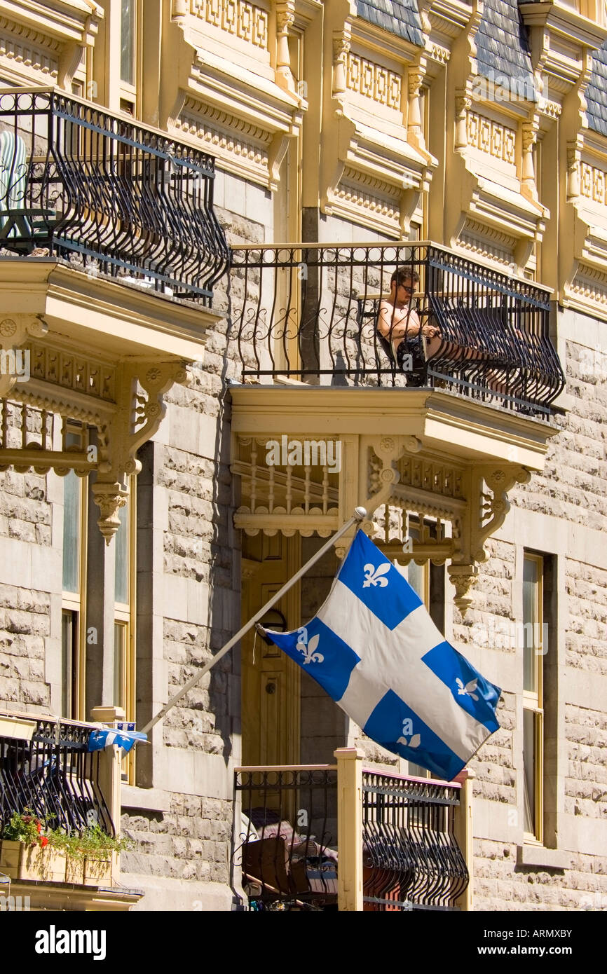 Quebec flag on typical building in Montreal, Quebec, Canada. Stock Photo