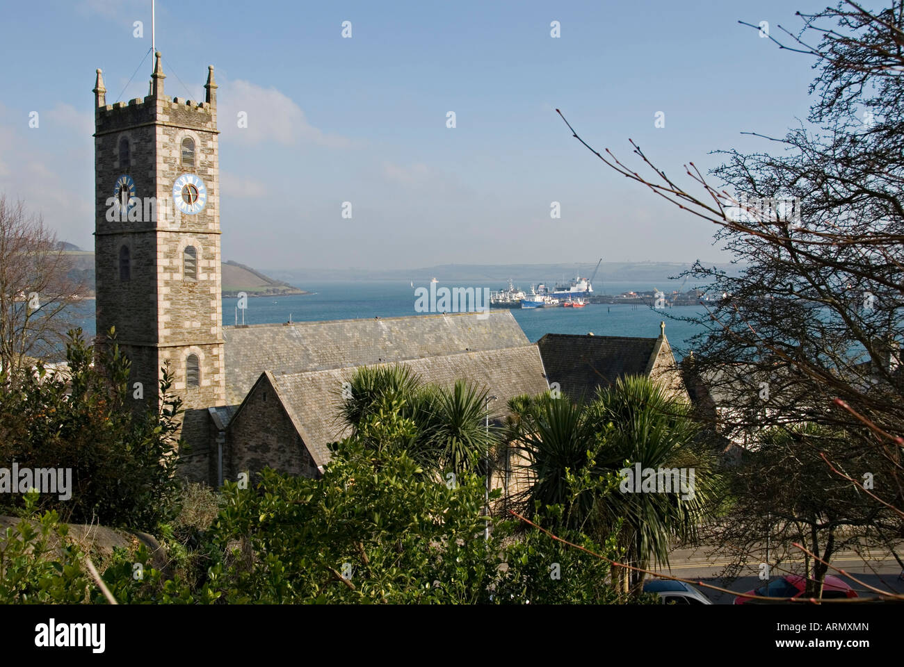 Falmouth, Cornwall, UK. The Church of King Charles the Martyr, 1665, with Carrick Roads (the River Fal estuary) in the background Stock Photo