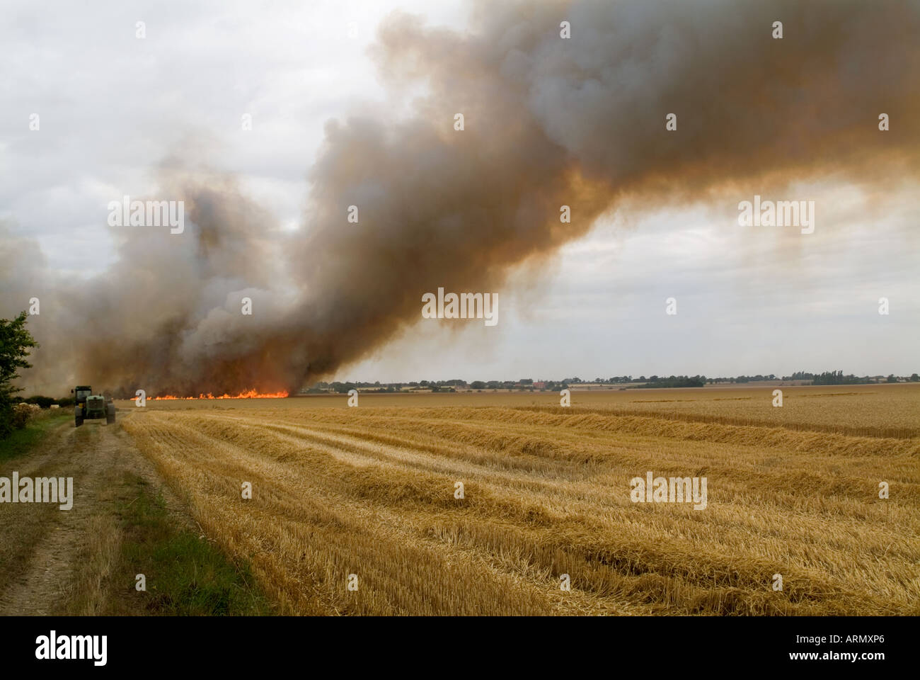 Distant view shoing the start of a fied fire with a large plume of smoke, Norwich, 2006. Stock Photo
