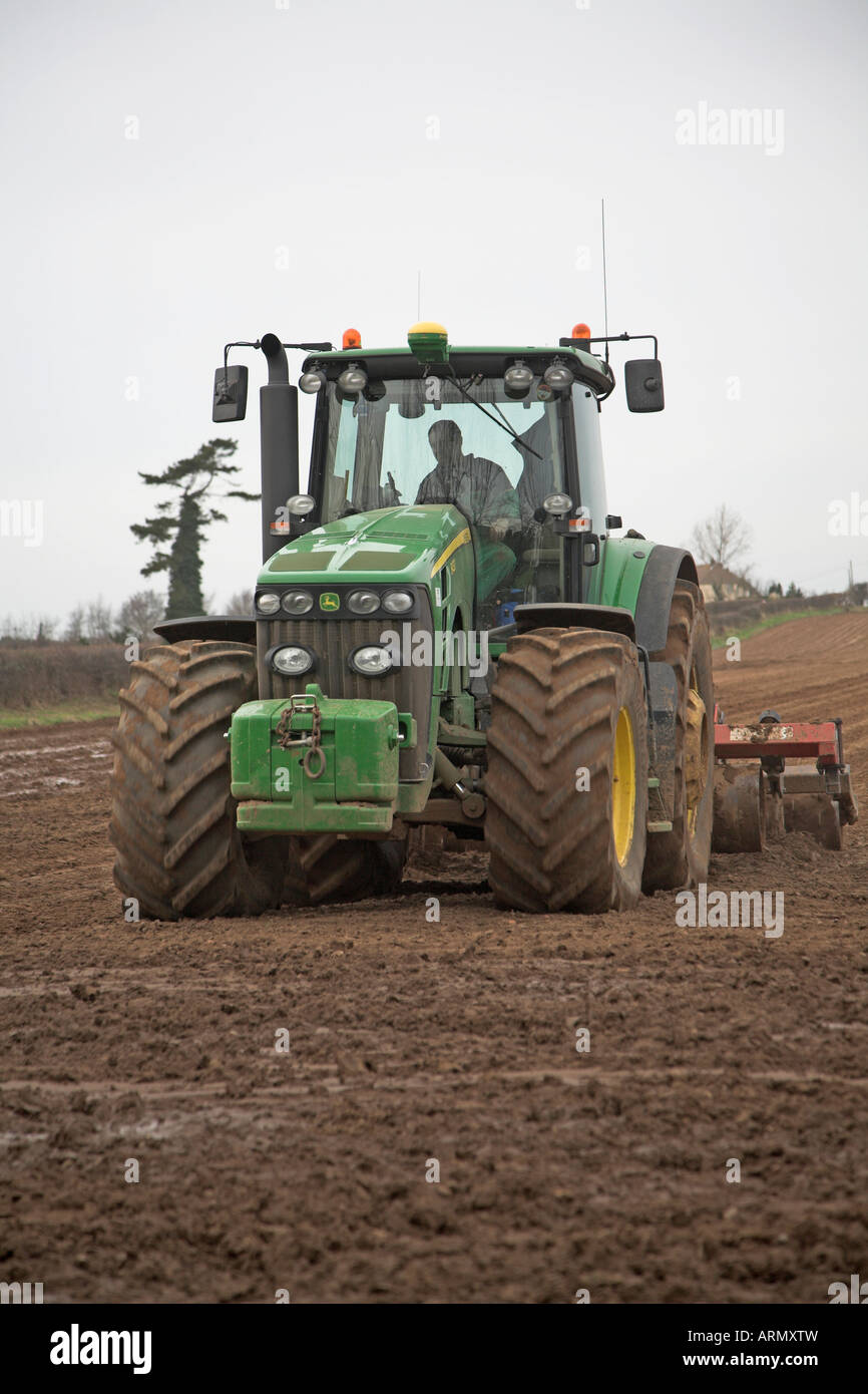 John Deere Tractor harrowing field Butley Suffolk England Stock Photo ...