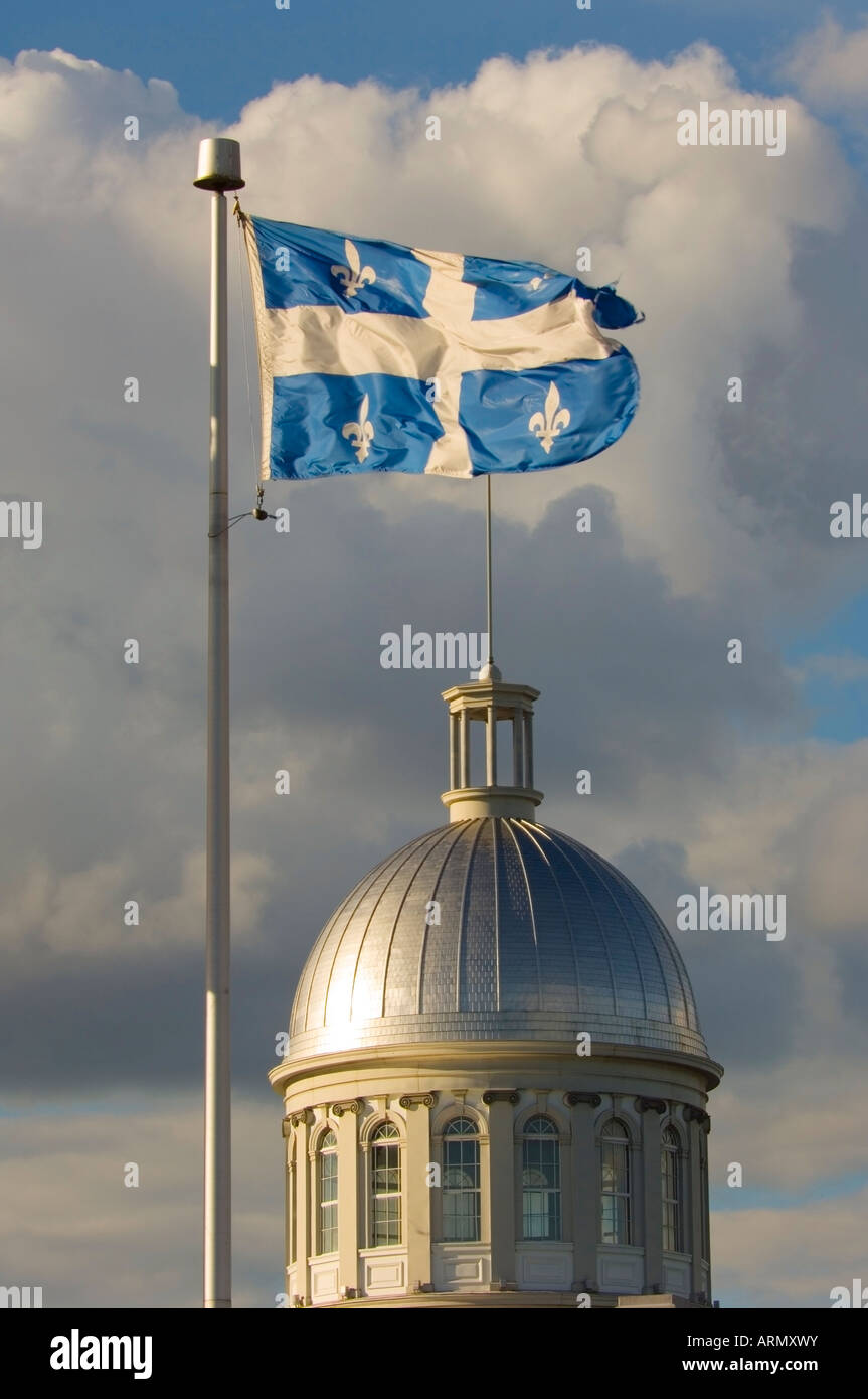 Flag of province of Quebec flies over the dome of Bonssecour Market in old Montreal, Montreal, Quebec, Canada. Stock Photo