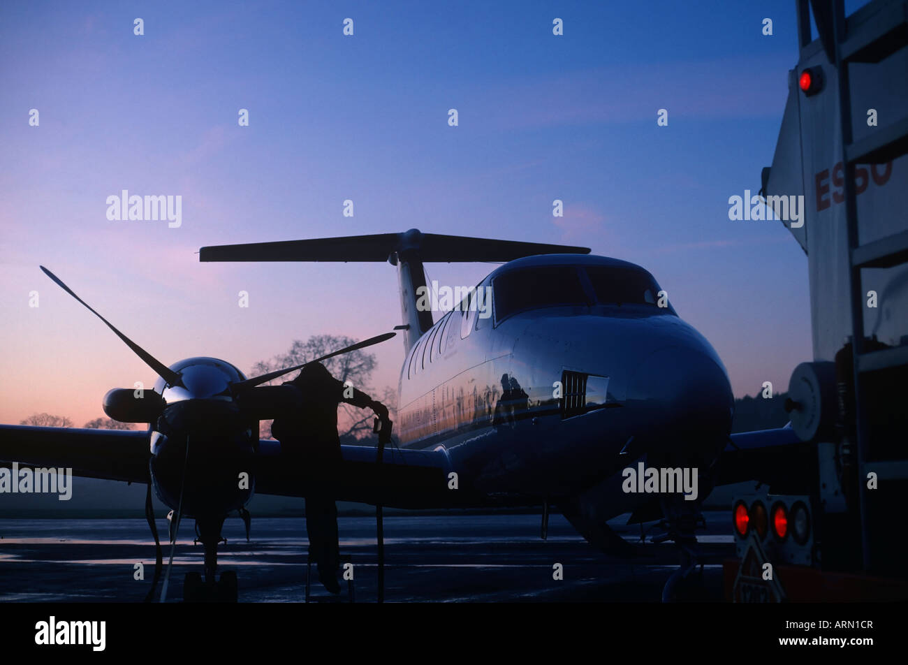 Beech 200 turbo aircraft being refueled at dawn, Victoria International Airport, Vancouver Island, British Columbia, Canada. Stock Photo
