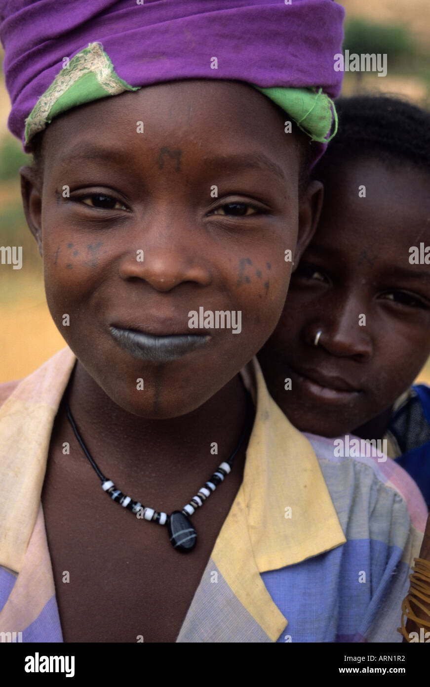 Near Niamey, Niger, Africa. Fulani Girls with Facial Scarification, Tattoos, Nose Ring. Stock Photo