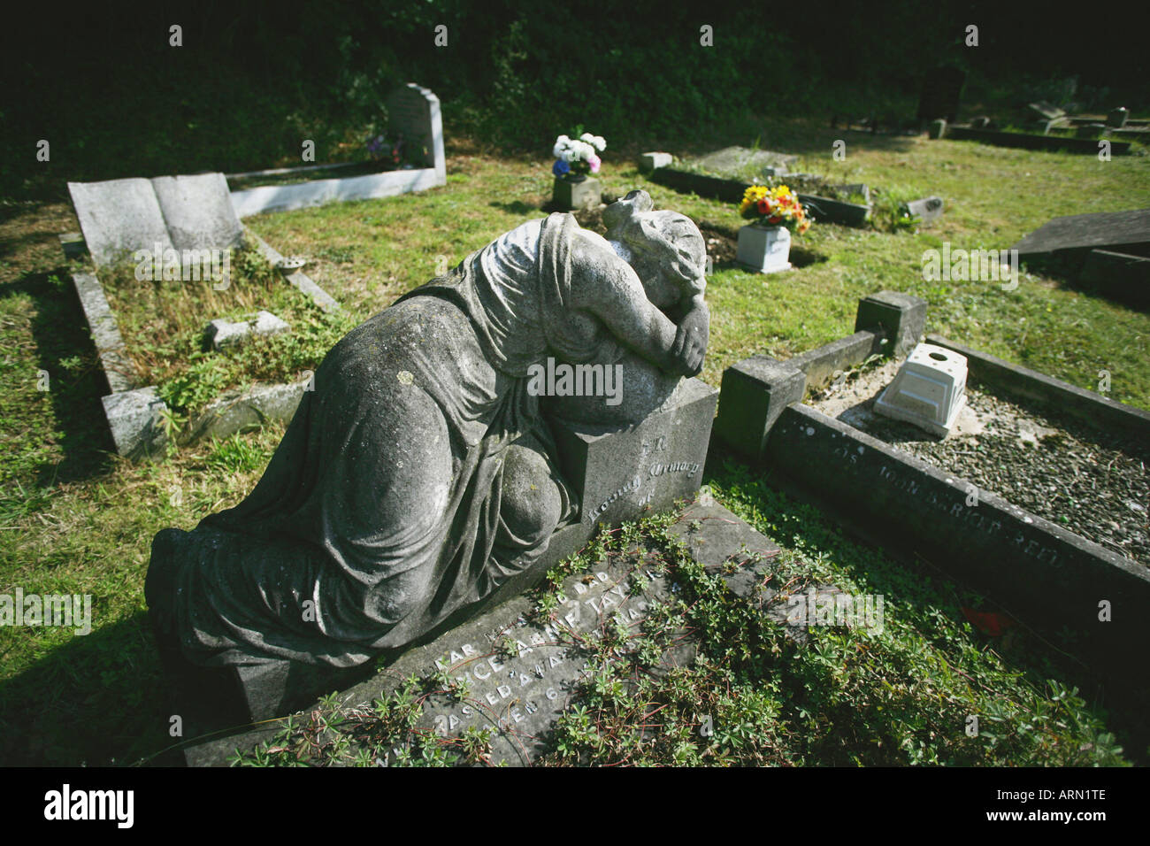 Statue of weeping woman in a cemetary, Essex, England, UK. Stock Photo