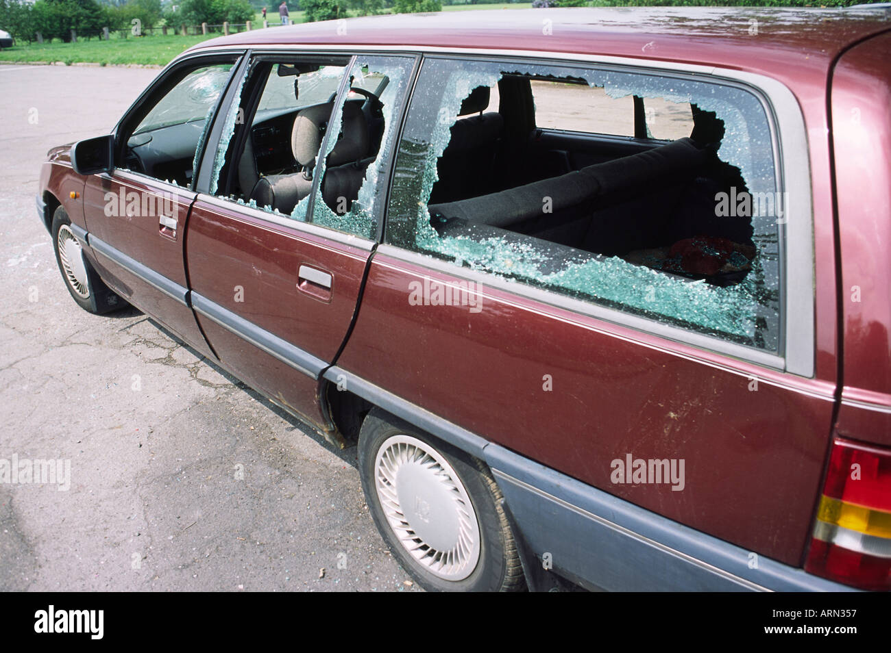 Vandalised car with smashed windows Stock Photo Alamy