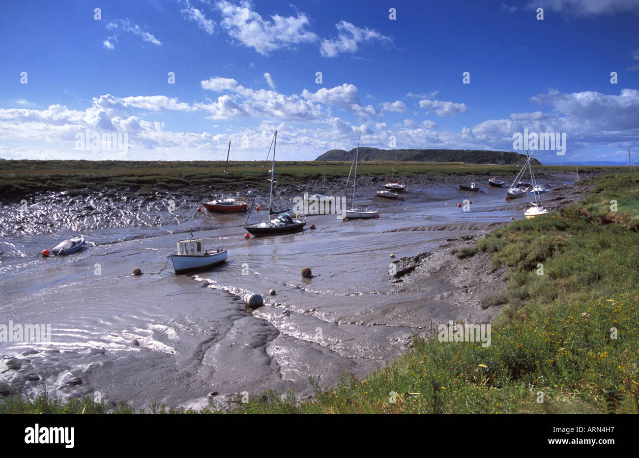 Boats in the Mouth of the river Axe Weston Bay Severn Estuary protected area North Somerset England Stock Photo