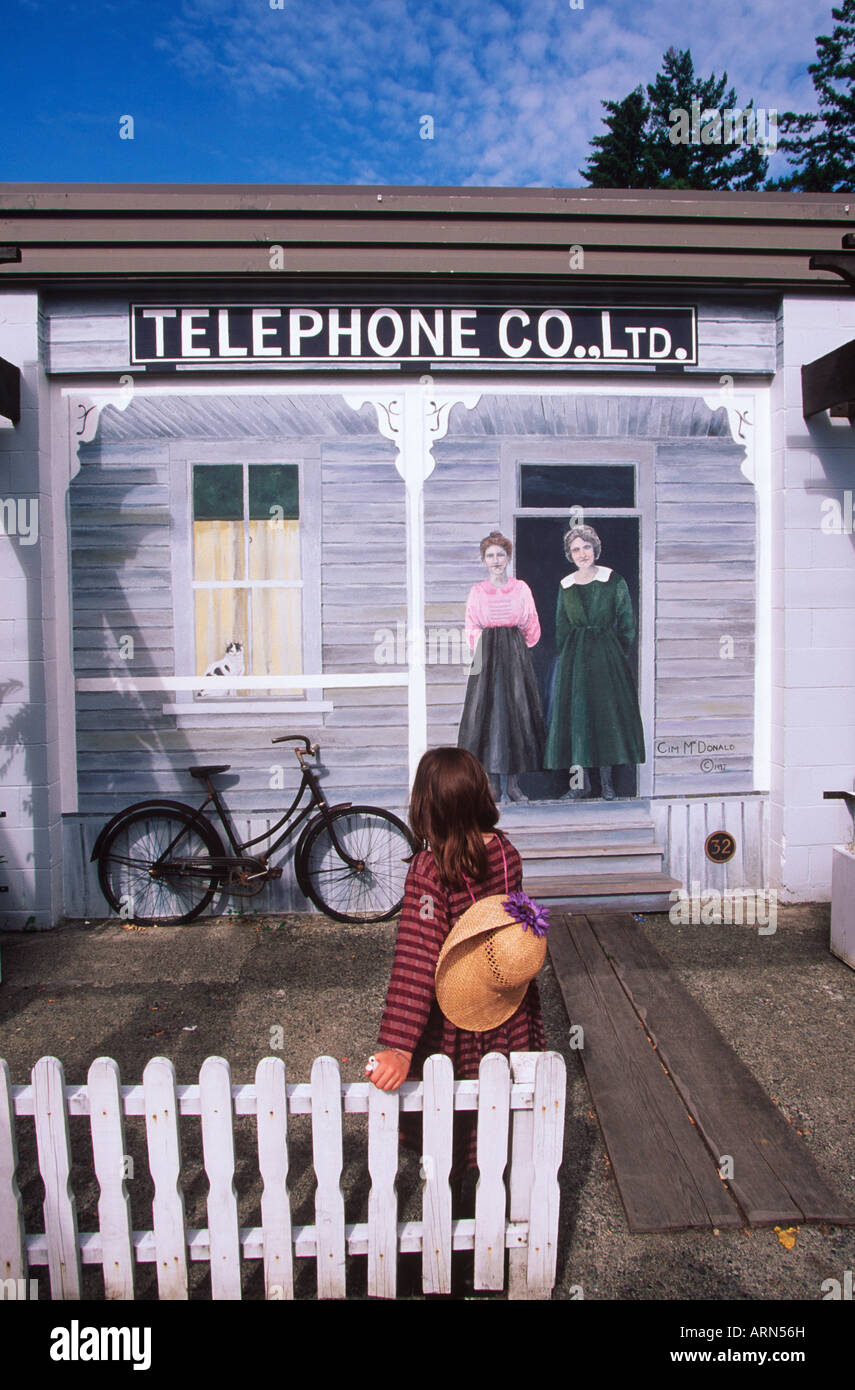 girl in front of mural, Chemainus (town of murals), Vancouver Island