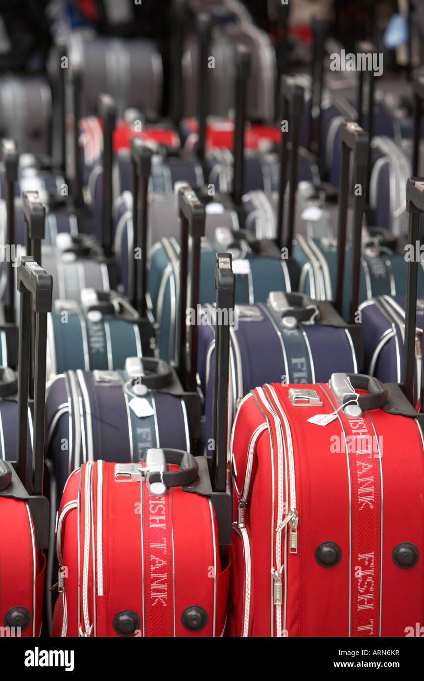 rows of wheeled luggage cases in a row outside a shop in puerto de la