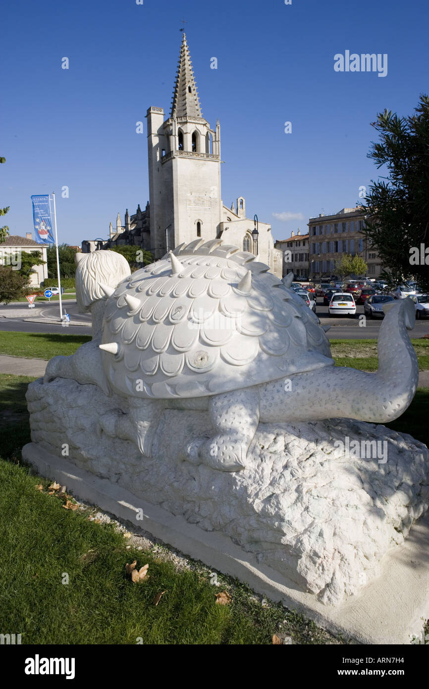 La Tarasque a sculpture by Pascal Demaumont with the Sainte Marthe Collegiate Church in the
