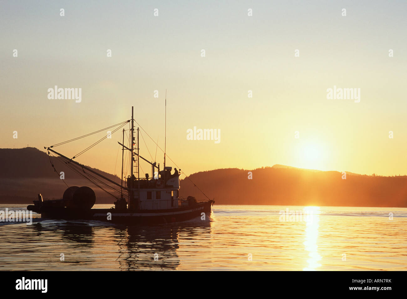 Vancouver Island commercial fishboat in sunset, British Columbia, Canada Stock Photo