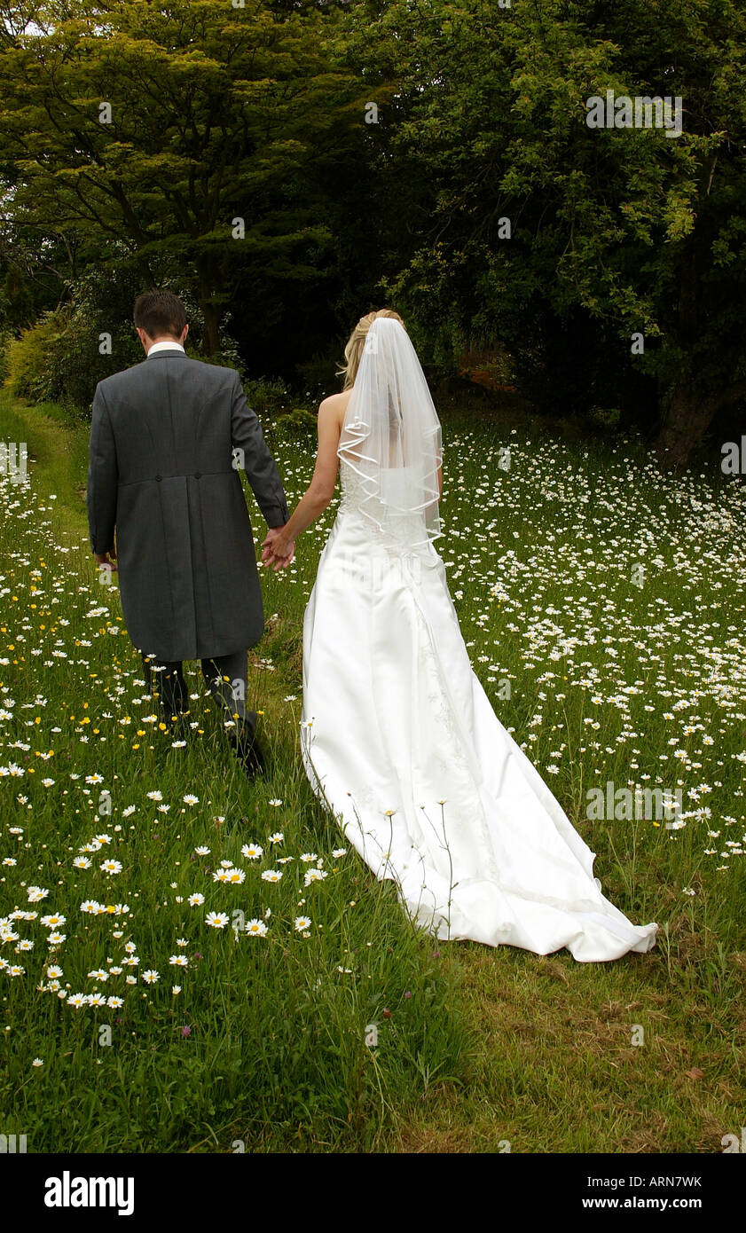 Bride and groom walking away hi-res stock photography and images - Alamy