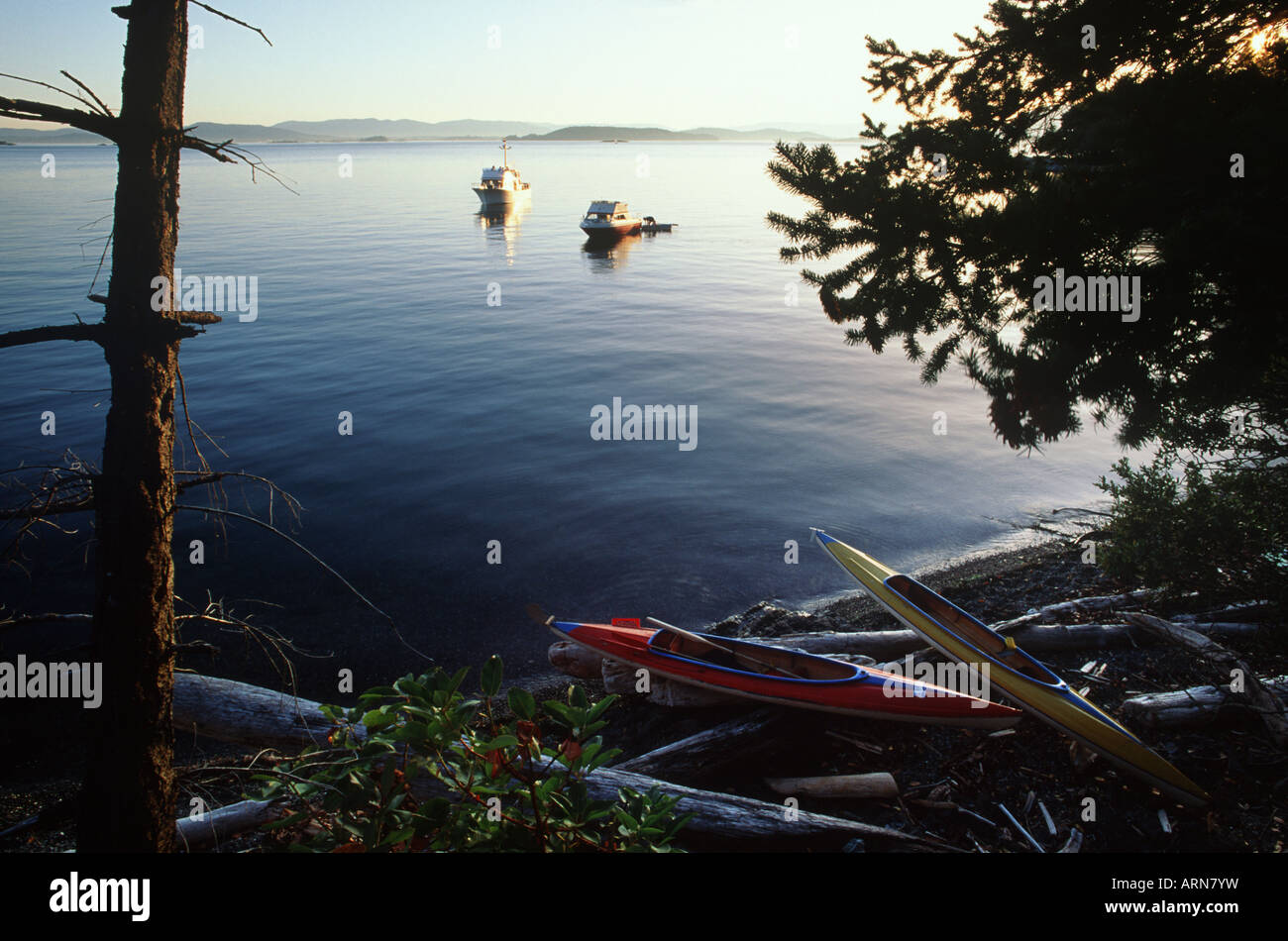 Gulf Islands ocean kayaks on beach, yachts anchored, Vancouver Island