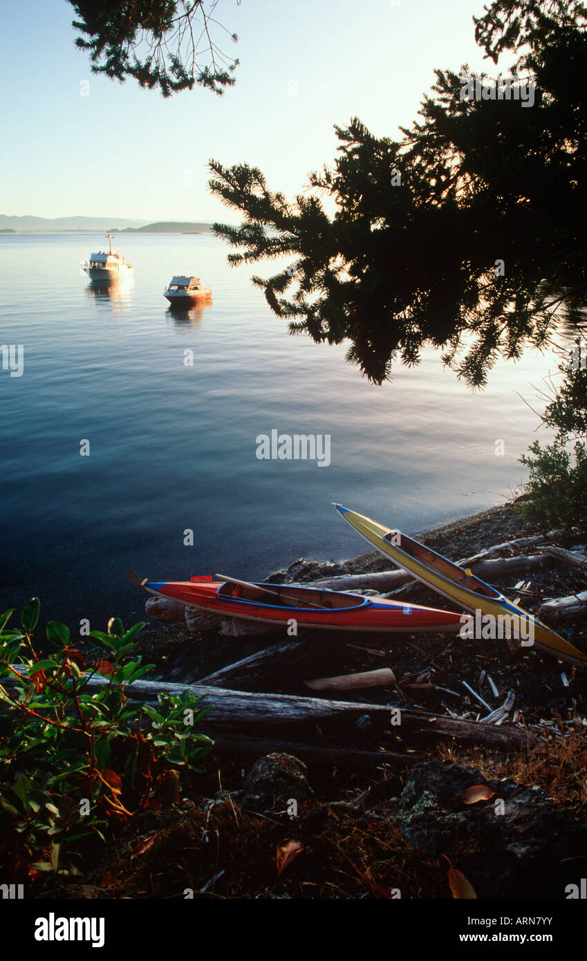 Gulf Islands ocean kayaks on beach, yachts anchored, Vancouver Island