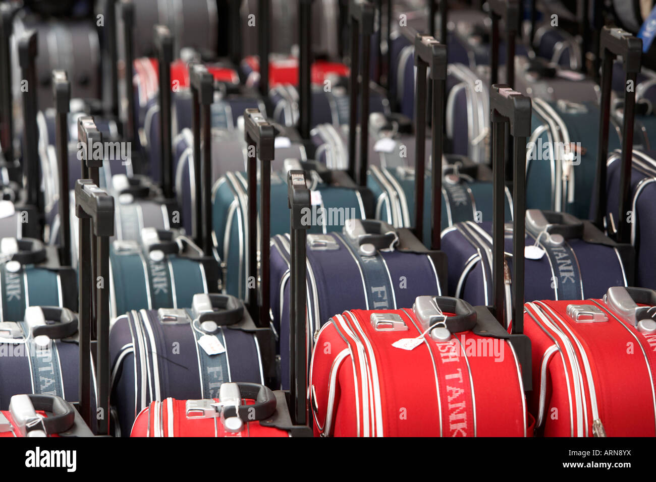 rows of wheeled luggage cases in a row outside a shop in puerto de la
