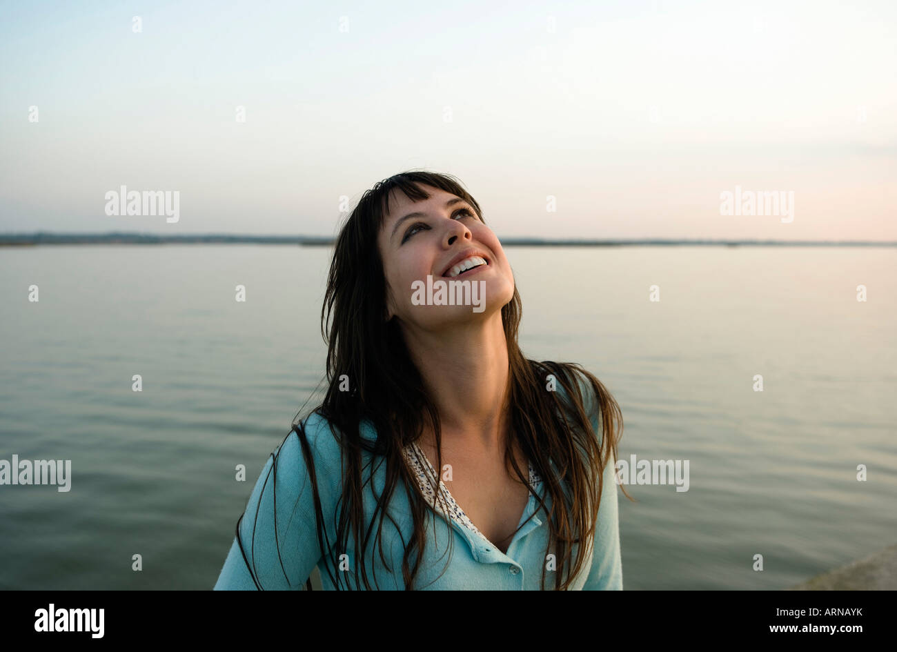 Girl laughing looking skywards Stock Photo