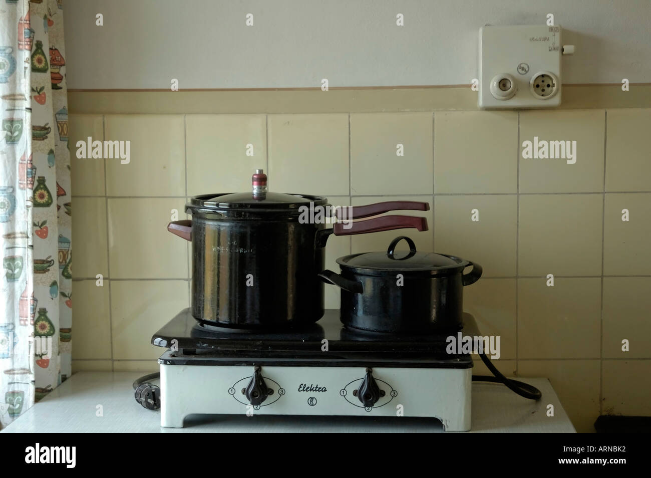 Old hotplate with two pots Stock Photo
