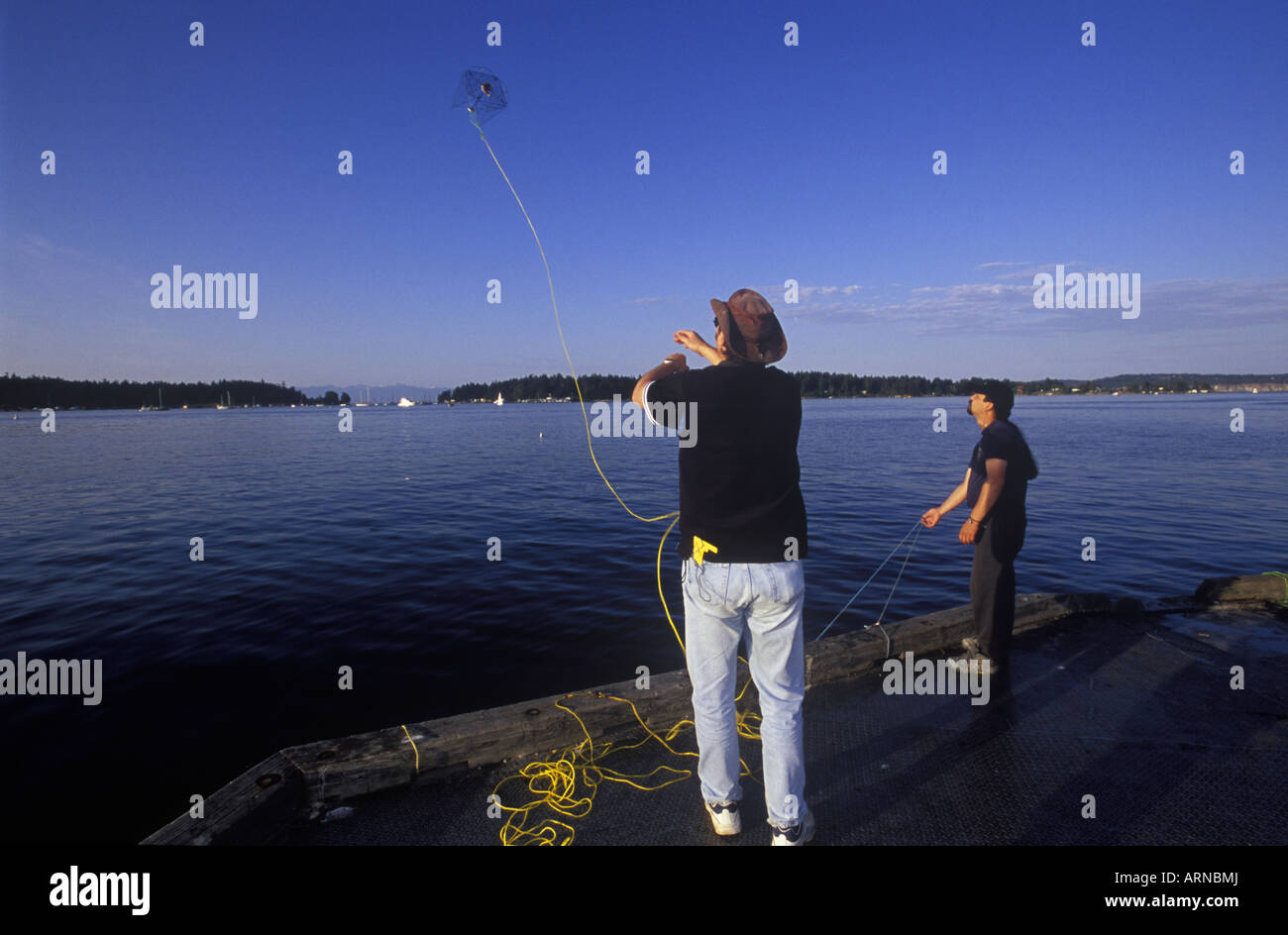 Nanaimo Harbour with people crossing bridge to public float, Vancouver