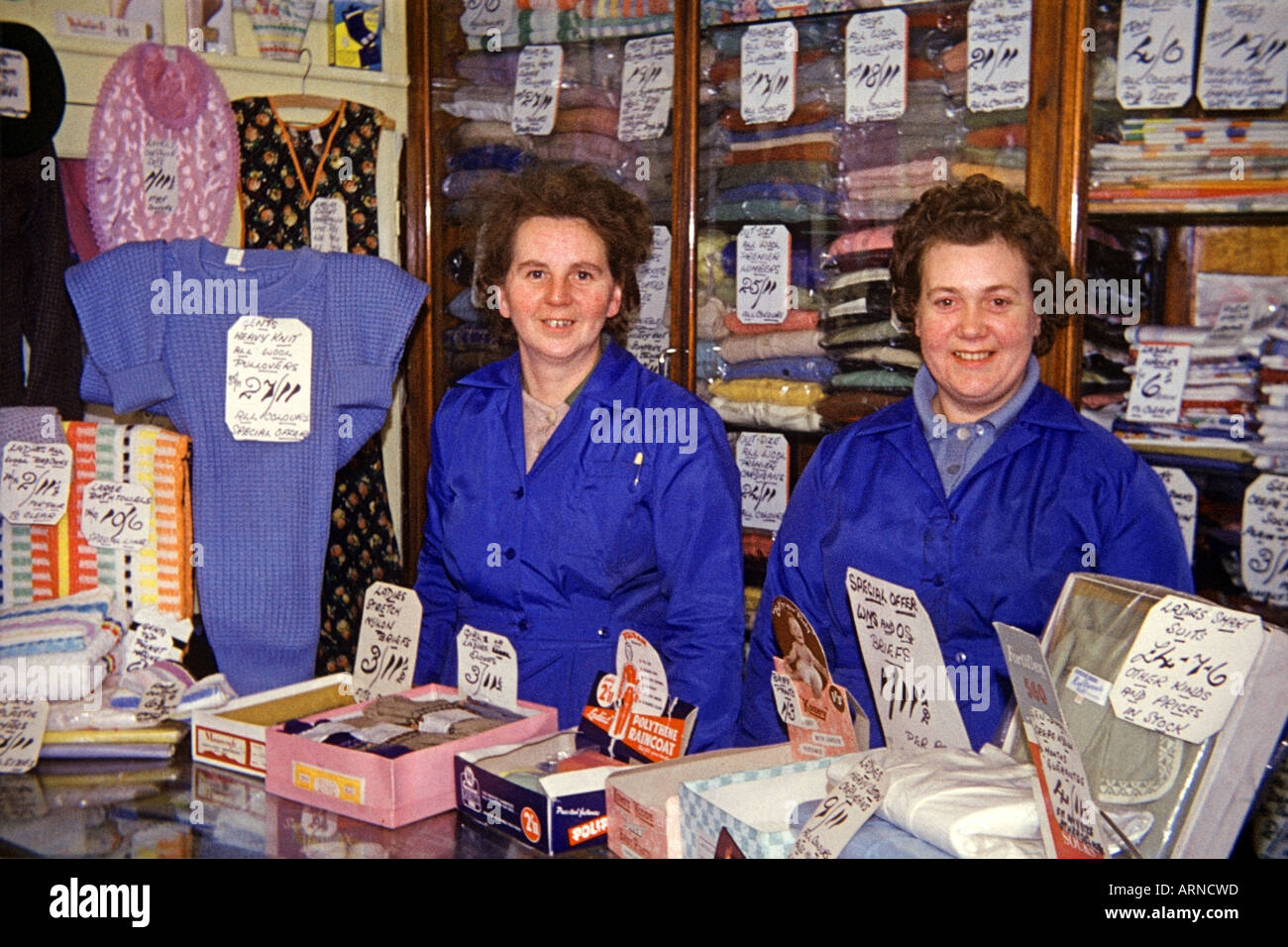 Belmont Drapery Stores Ltd, Stockport, 1950s 1960s with shop assistants in overalls and price tickets in £sd. JMH0984 Stock Photo