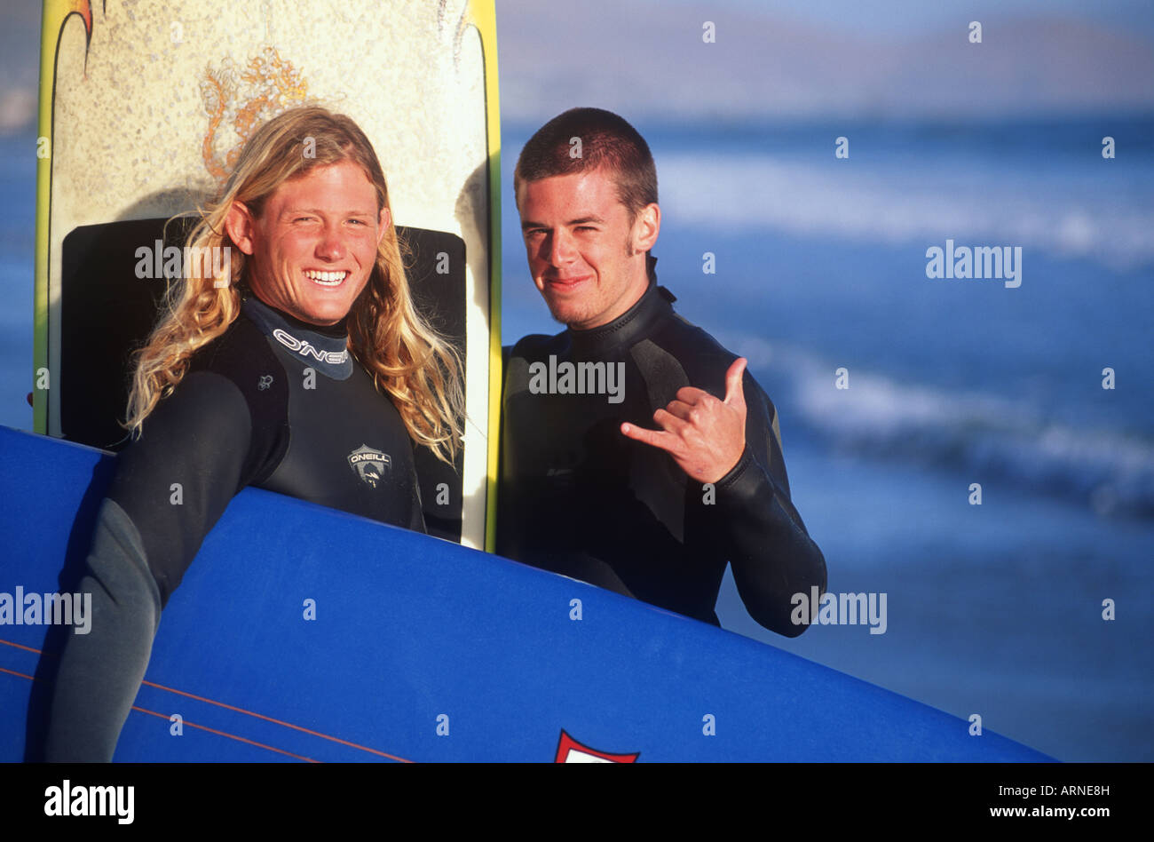 two young male surfers on the beach, Pacific Rim, Longbeach, Vancouver Island, British Columbia, Canada. Stock Photo
