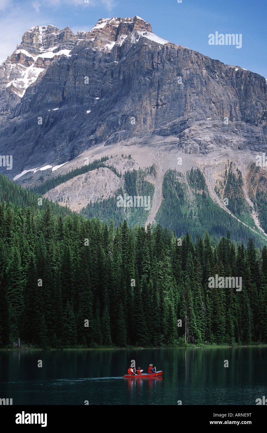 Emerald Lake, visitors paddle canoe on lake, British Columbia, Canada