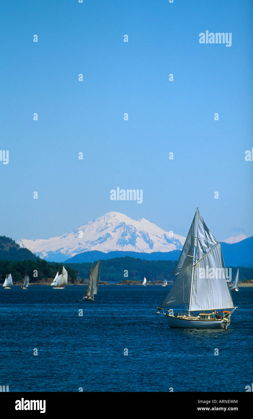 Sidney vista, with gaff rigged sail race and Mt Baker, Vancouver Island, British Columbia, Canada. Stock Photo