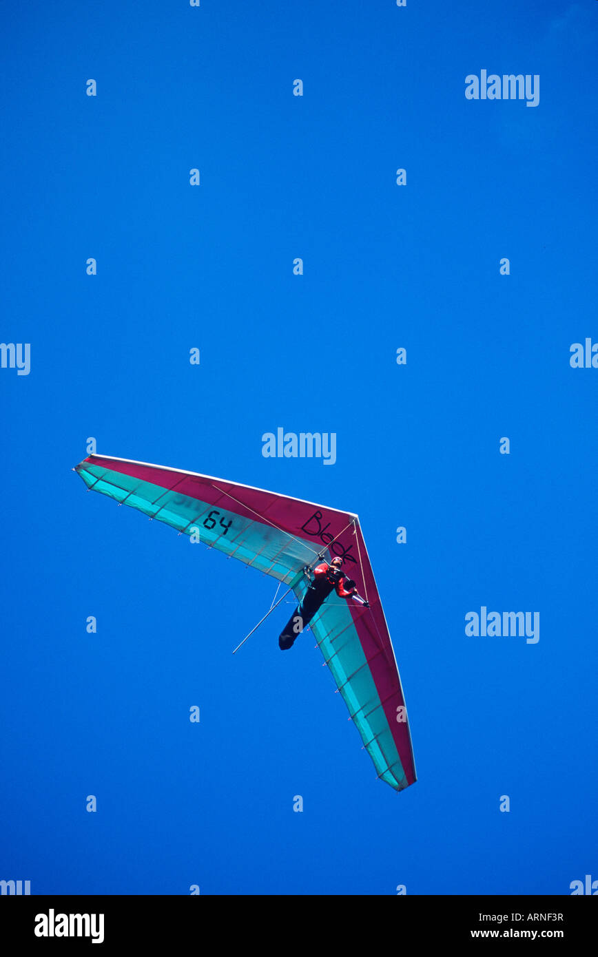 Hang glider in flight on blue sky, British Columbia, Canada. Stock Photo