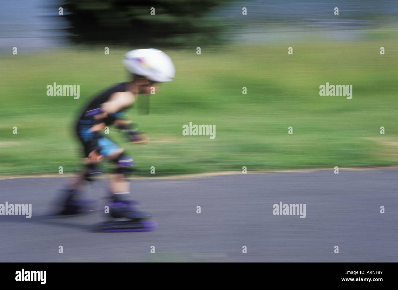 9 year old boy skates with inline gear hires stock photography and